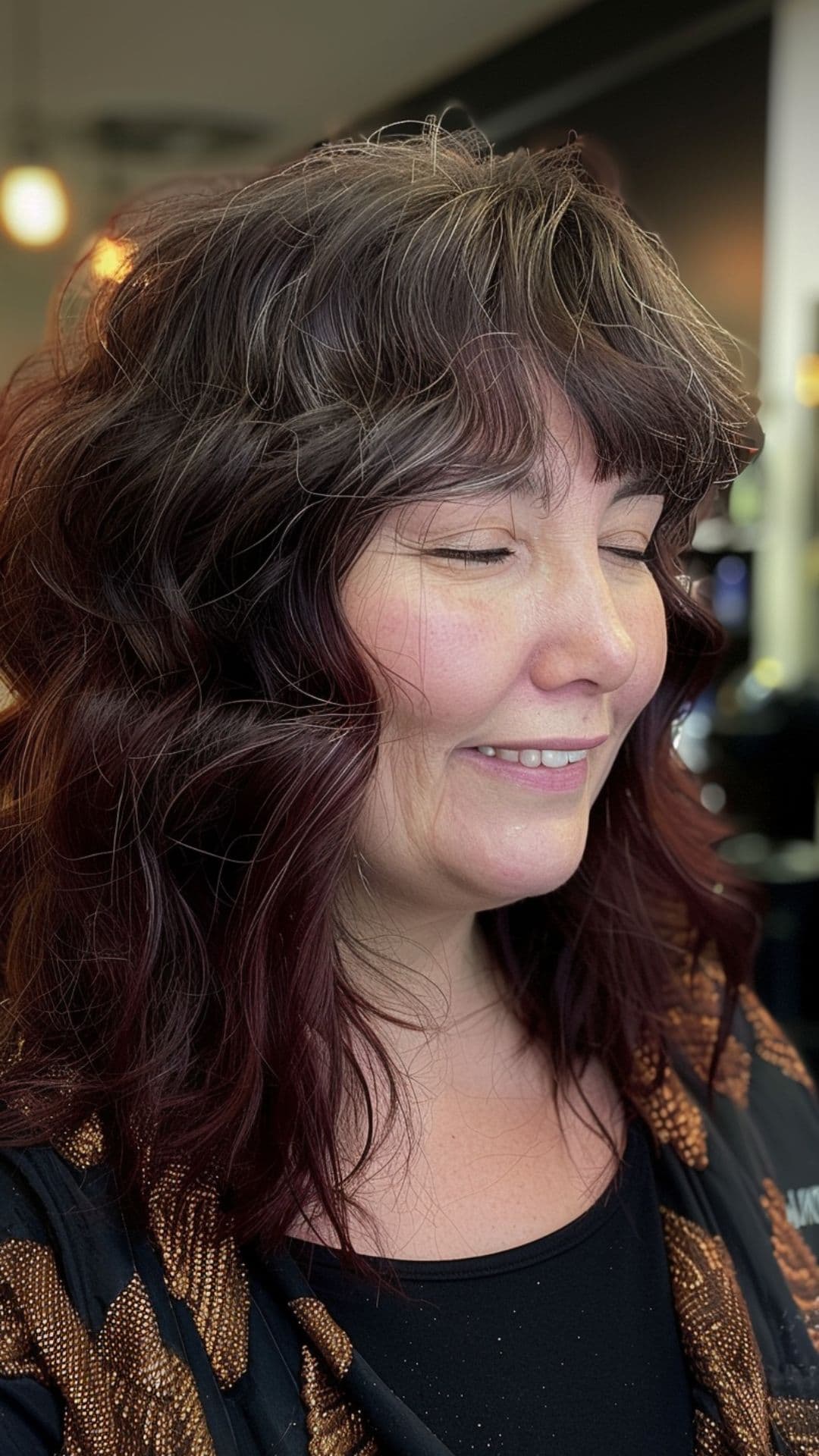 An old woman modeling textured bangs.