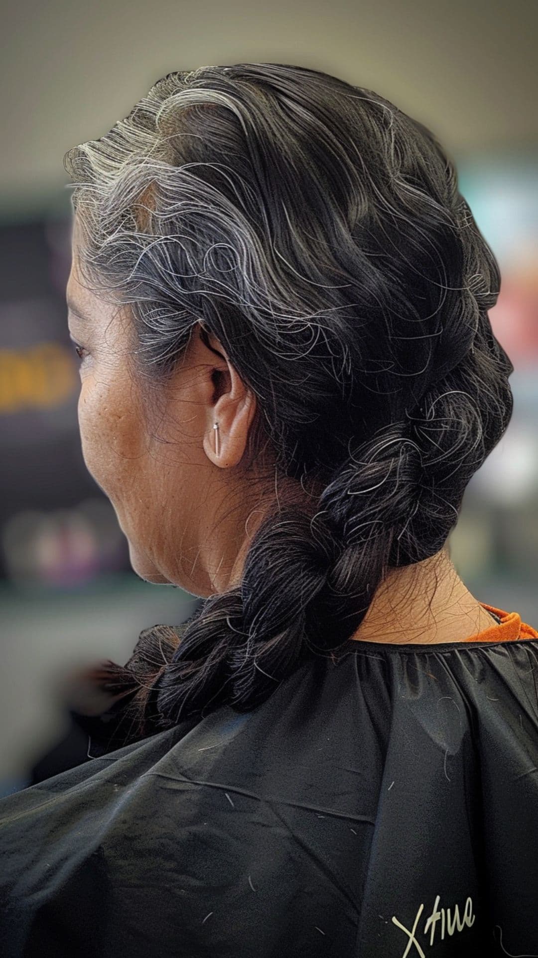 An old woman wearing a side bun.